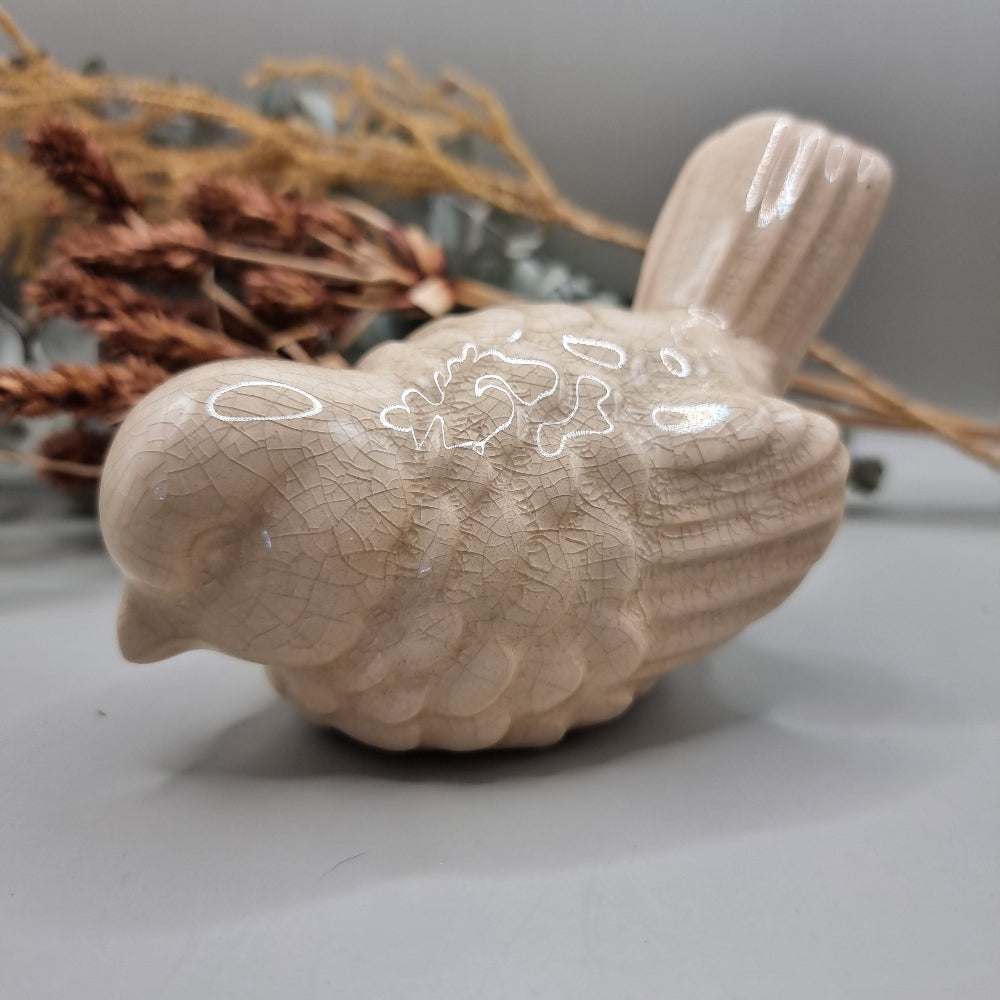 Cream ceramic bird figurine with crackle glaze finish