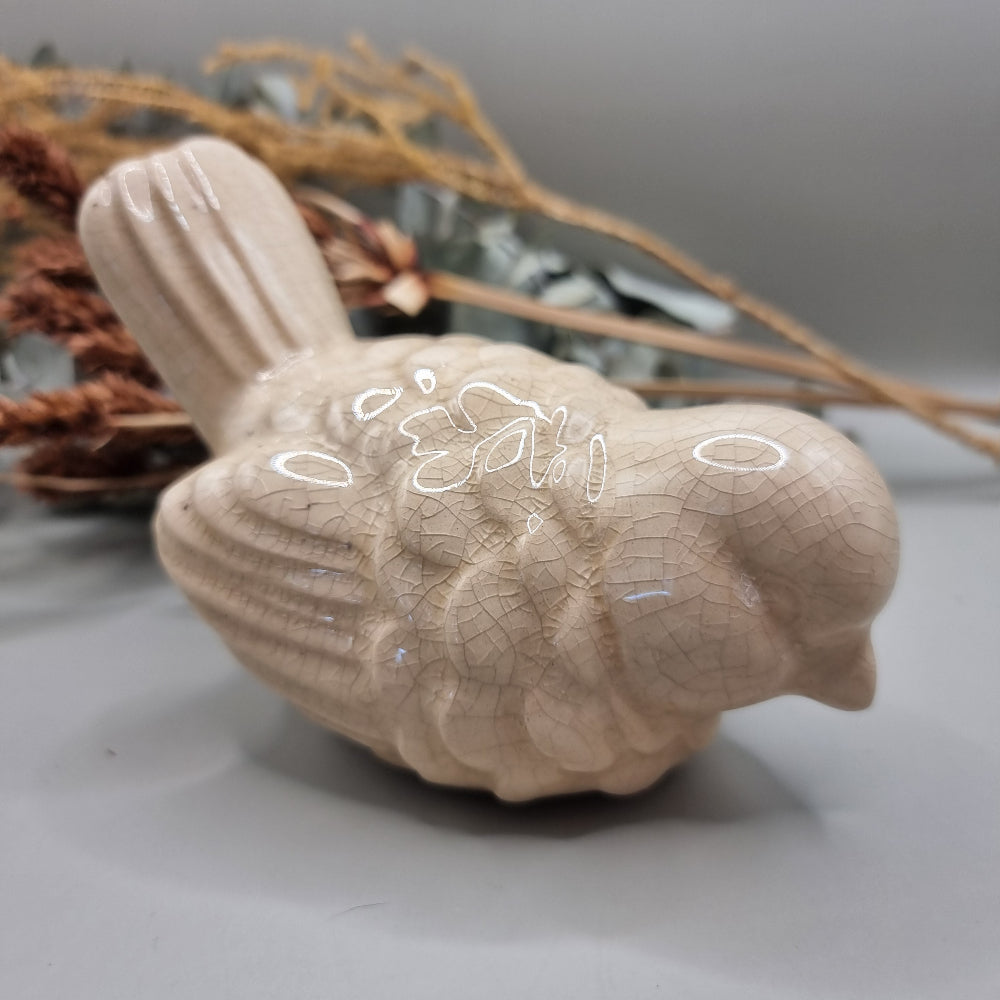 Cream ceramic bird figurine with crackle glaze finish