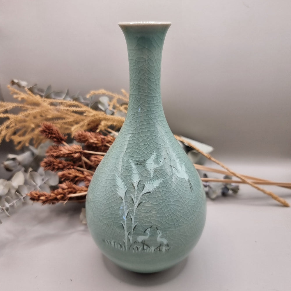 Celadon crackle glaze vase with crane and bamboo design in soft jade-green