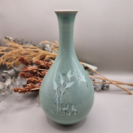 Celadon crackle glaze vase with crane and bamboo design in soft jade-green