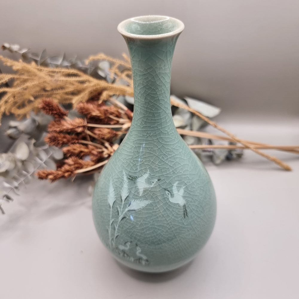 Celadon crackle glaze vase with crane and bamboo design in soft jade-green