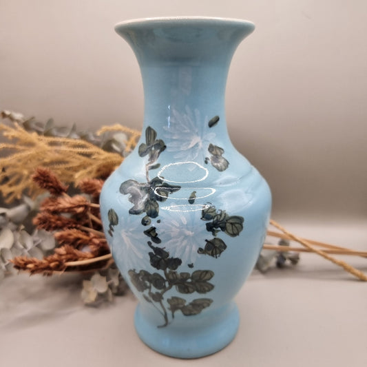 Vintage blue vase with hand-painted floral design and flared rim
