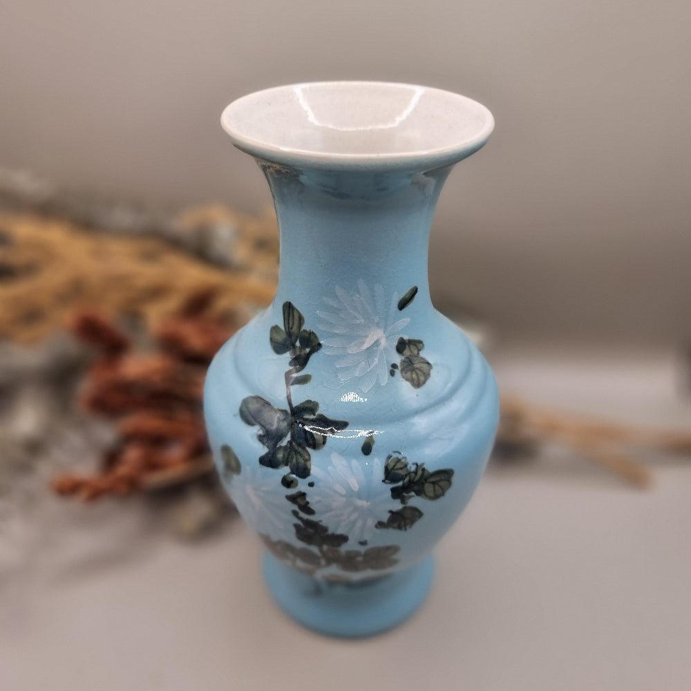 Vintage blue vase with hand-painted floral design and flared rim
