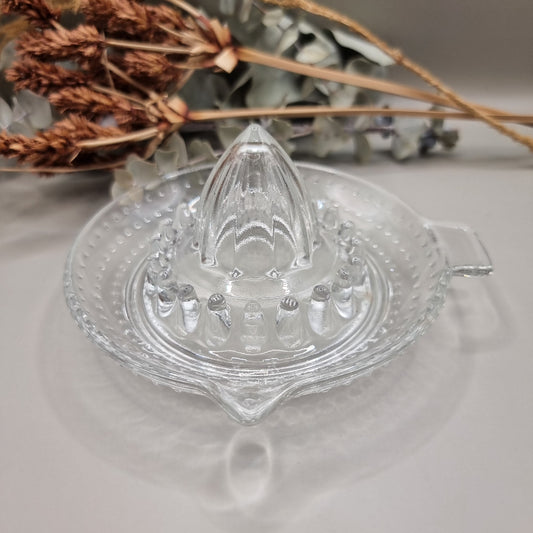 Vintage clear glass citrus juicer with spout and seed catcher