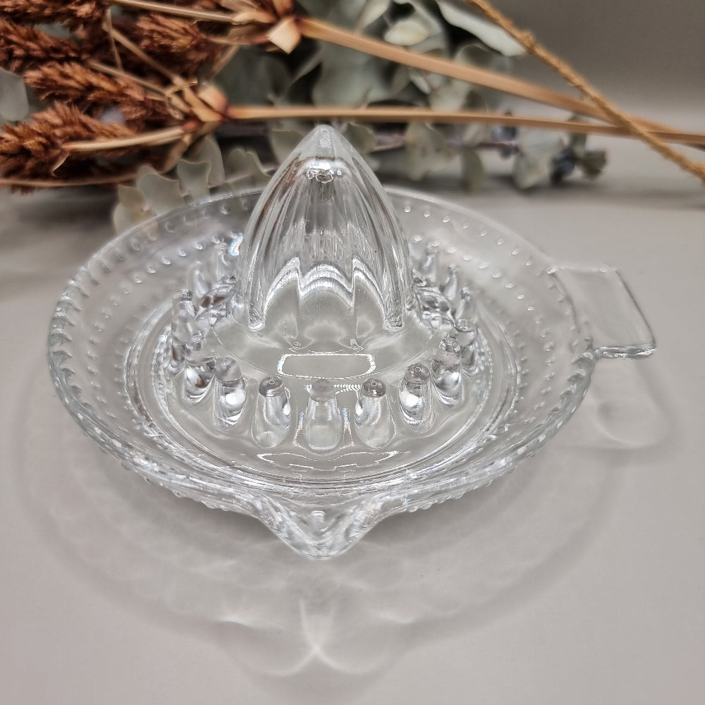 Vintage clear glass citrus juicer with spout and seed catcher