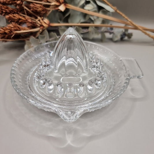 Vintage clear glass citrus juicer with spout and seed catcher