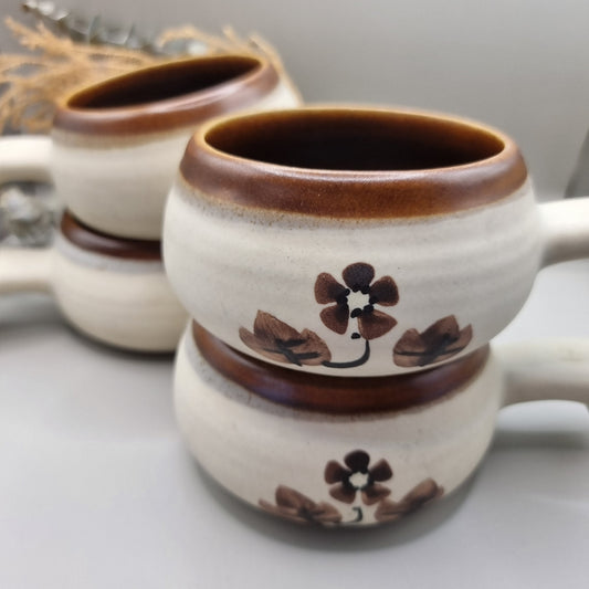 Set of 4 vintage soup bowls with brown rims and floral design.