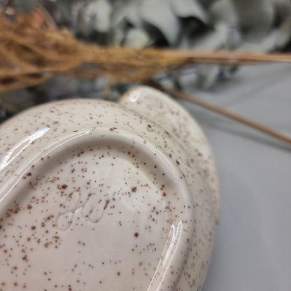 Rectangular speckled stoneware dish with brown glaze and yellow rose floral decals.