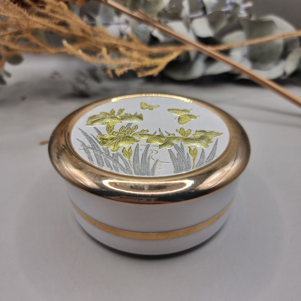 Round lidded trinket box with gold irises and butterfly design in Art of Chokin style