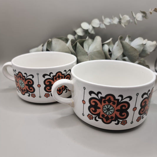 Set of 2 soup bowls with retro orange and brown floral pattern.