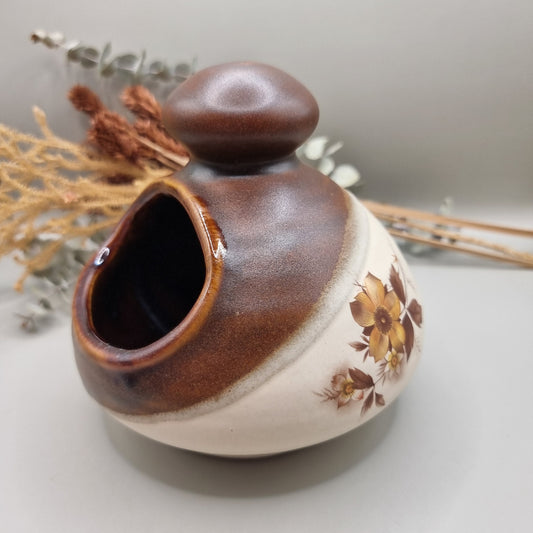 Royal Oak pottery salt pig with brown glaze and floral pattern