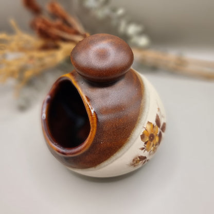 Royal Oak pottery salt pig with brown glaze and floral pattern