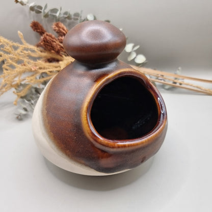 Royal Oak pottery salt pig with brown glaze and floral pattern