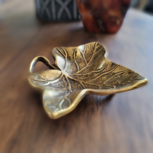 Vintage brass ivy leaf trinket dish with curled stem and embossed detailing