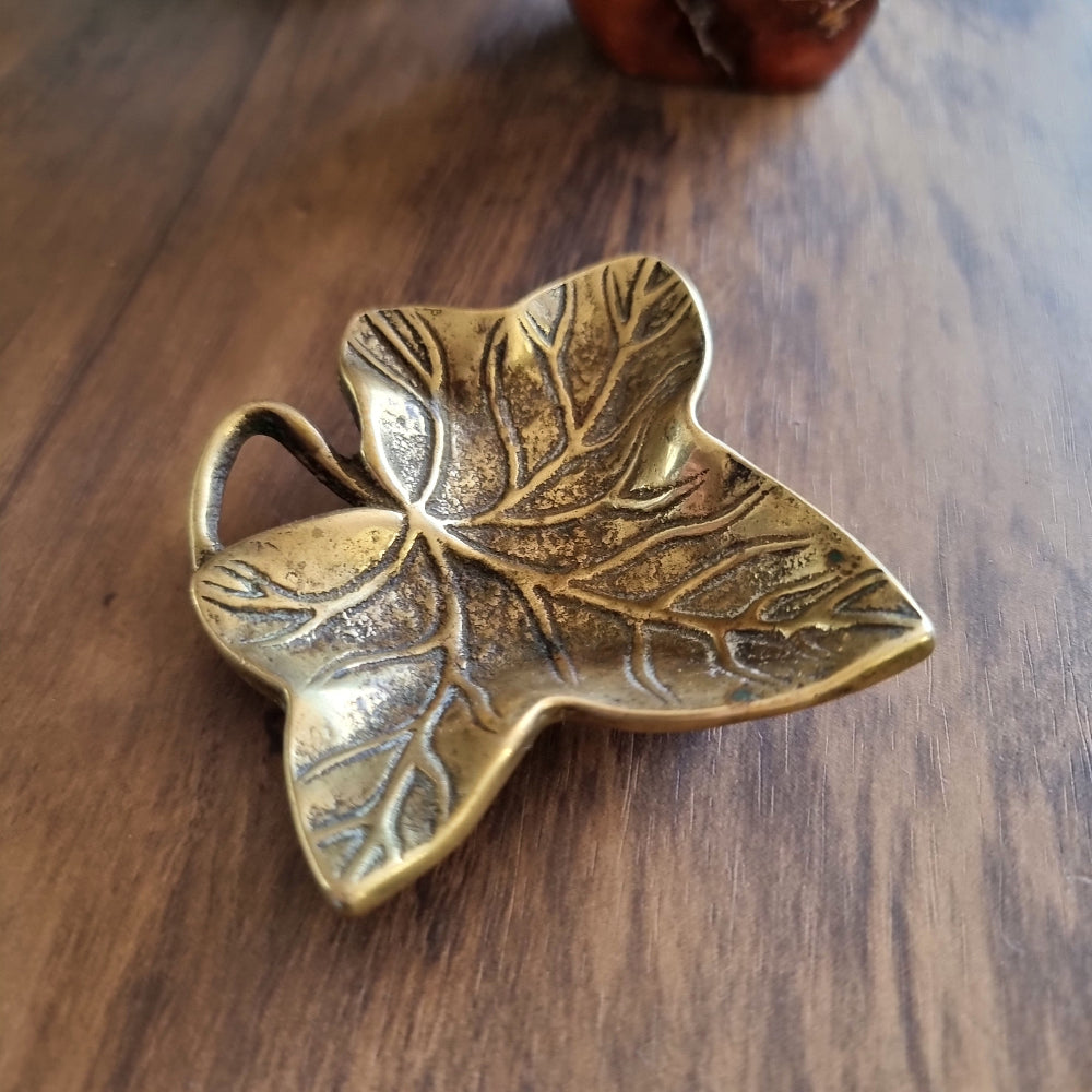 Vintage brass ivy leaf trinket dish with curled stem and embossed detailing