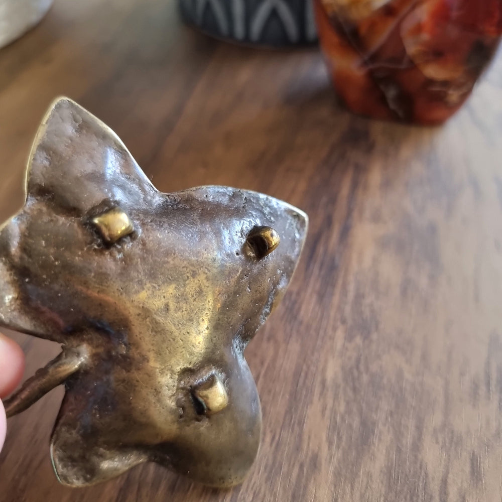 Vintage brass ivy leaf trinket dish with curled stem and embossed detailing