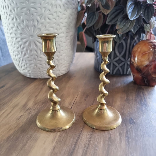 Pair of vintage brass candlesticks with twisted spiral stems.