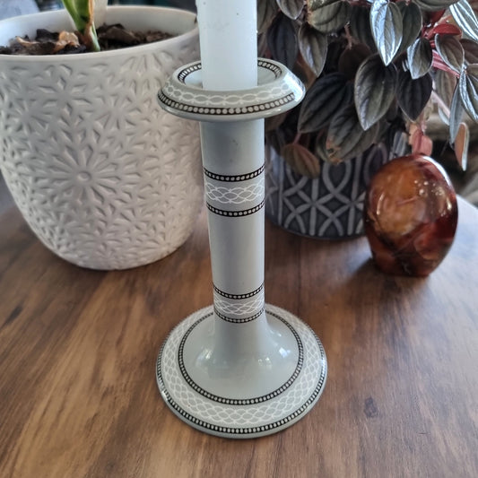 Grey ceramic candlestick holder with white and black geometric detail