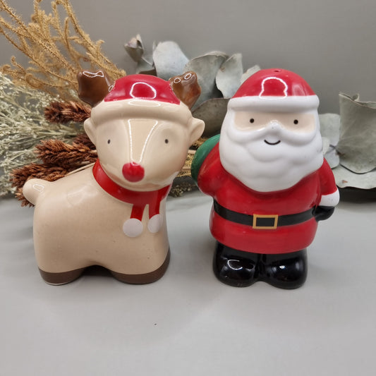 Ceramic Santa and Reindeer salt and pepper shakers, a festive vintage-style Christmas pair.