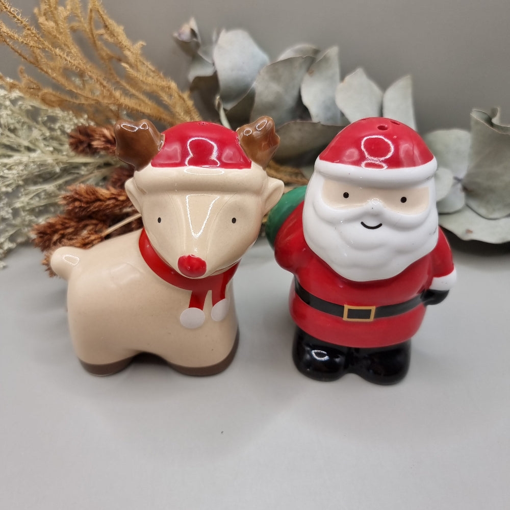 Ceramic Santa and Reindeer salt and pepper shakers, a festive vintage-style Christmas pair.