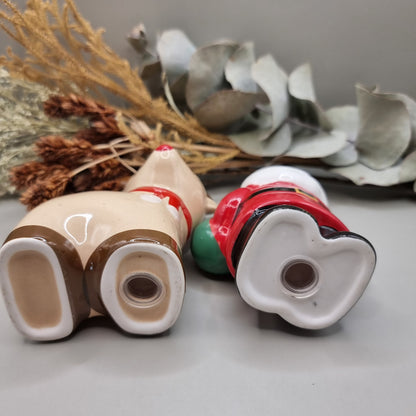 Ceramic Santa and Reindeer salt and pepper shakers, a festive vintage-style Christmas pair.