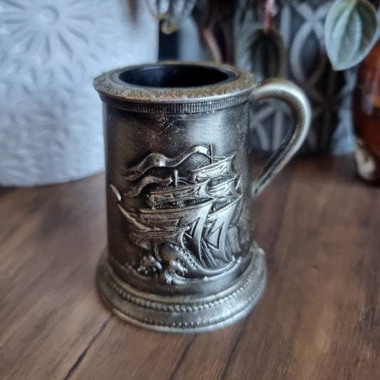 Pewter-look tankard with embossed sailing ship design and handle