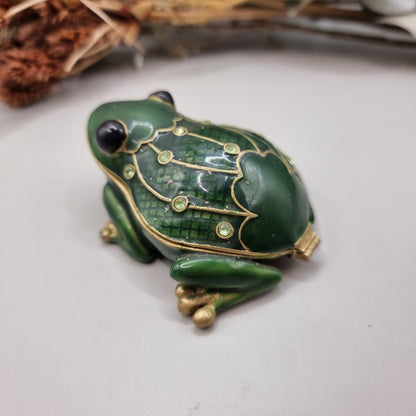 Green enamel frog trinket box with gold trim and rhinestones.