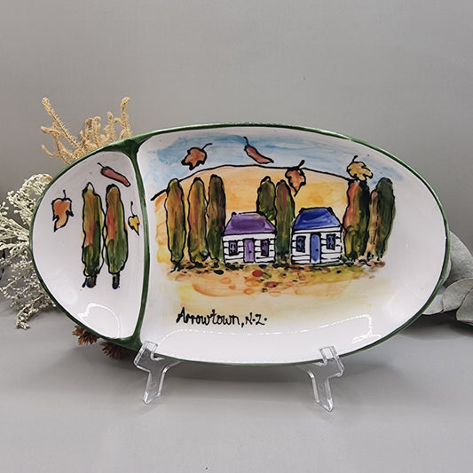 Hand-painted ceramic dish with Arrowtown cottages and autumn trees, signed Arrowtown, N.Z.