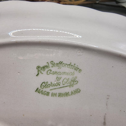 Clarice Cliff Royal Staffordshire oval dish with scalloped edge and wheat design in black, grey, and purple.