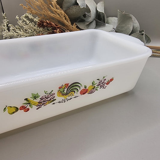 Vintage Anchor Hocking Fire-King loaf dish with rooster and fruit design on white milk glass
