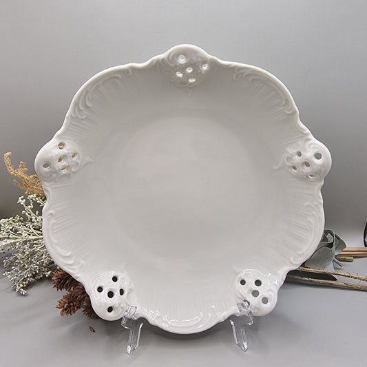 White Rosenthal Classic Rose porcelain dish with pierced edge and embossed scroll detail, made in Germany.