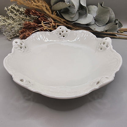 White Rosenthal Classic Rose porcelain dish with pierced edge and embossed scroll detail, made in Germany.