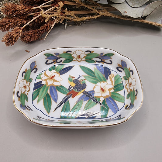 Chinese porcelain dish with colourful birds, green leaves, white flowers and gold trim.