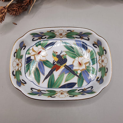 Chinese porcelain dish with colourful birds, green leaves, white flowers and gold trim.