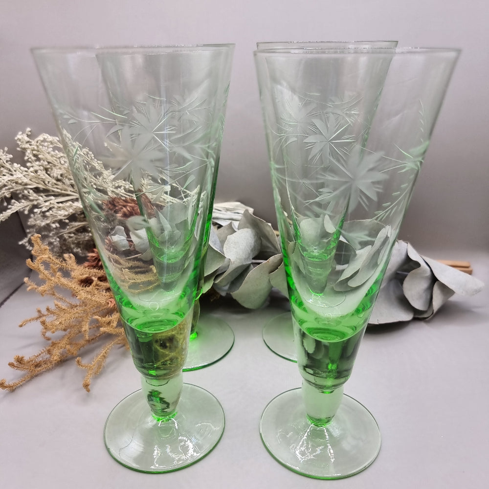 Set of 4 tall green etched flutes with starburst and leaf design.