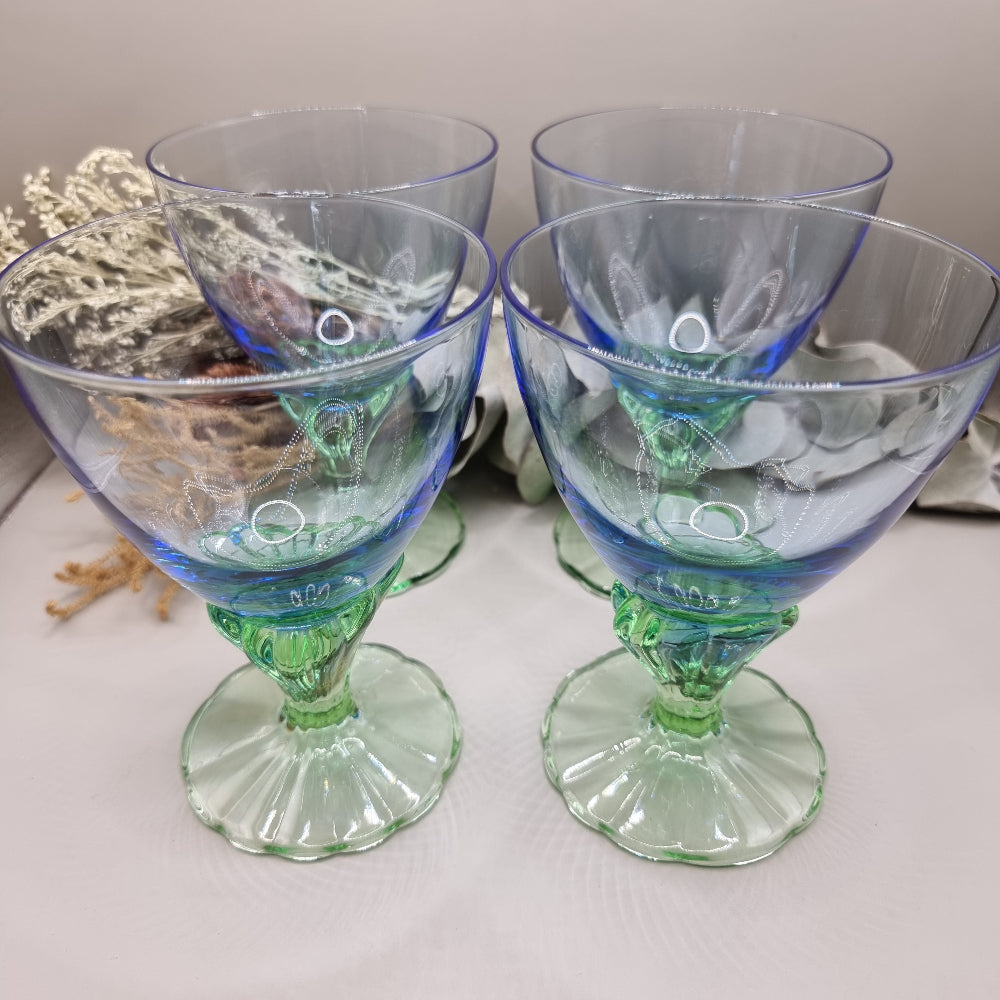 Set of 4 Bormioli Rocco Bahia goblets with blue bowls and green scalloped stems.