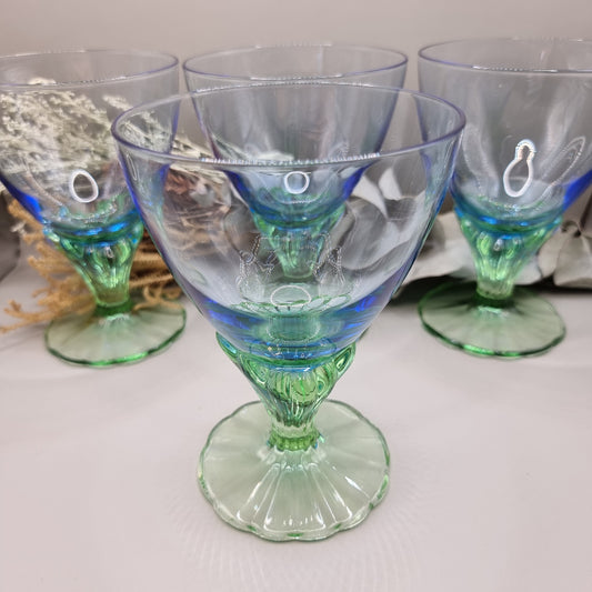 Set of 4 Bormioli Rocco Bahia goblets with blue bowls and green scalloped stems.