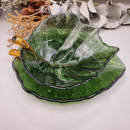 Green glass Dynasty Gallery olive leaf bowl and plate with gold stem detail.