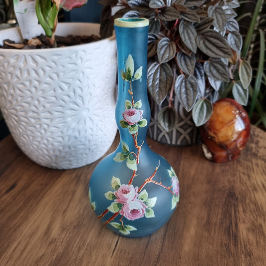 Blue satin glass vase with hand-painted pink roses and green leaves