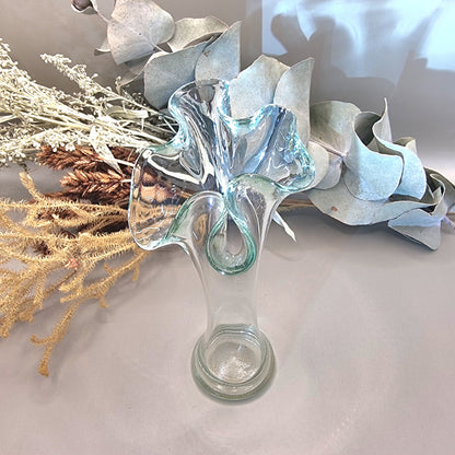 Clear handblown art glass vase with ruffled fluted top