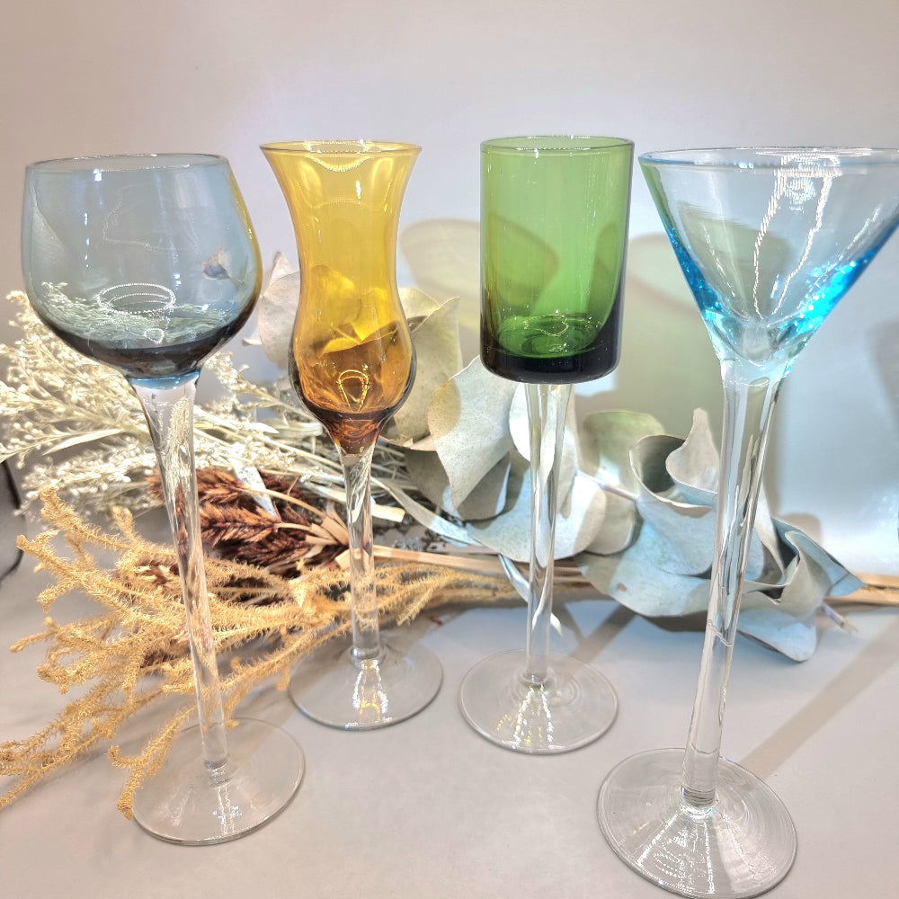Set of four tall vintage coloured glasses with long stems