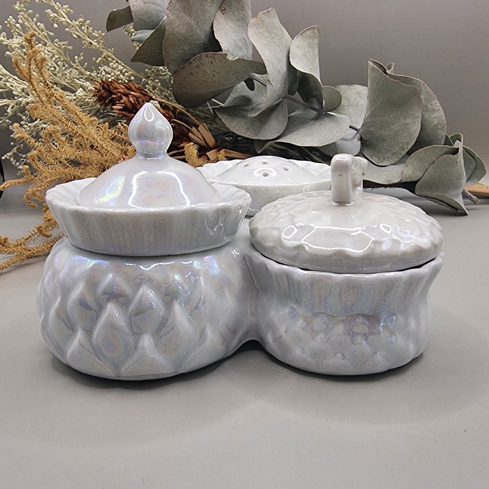 Sparkling vintage ceramic condiment set with pearly glaze. Lidded pots and shaker with central handle.