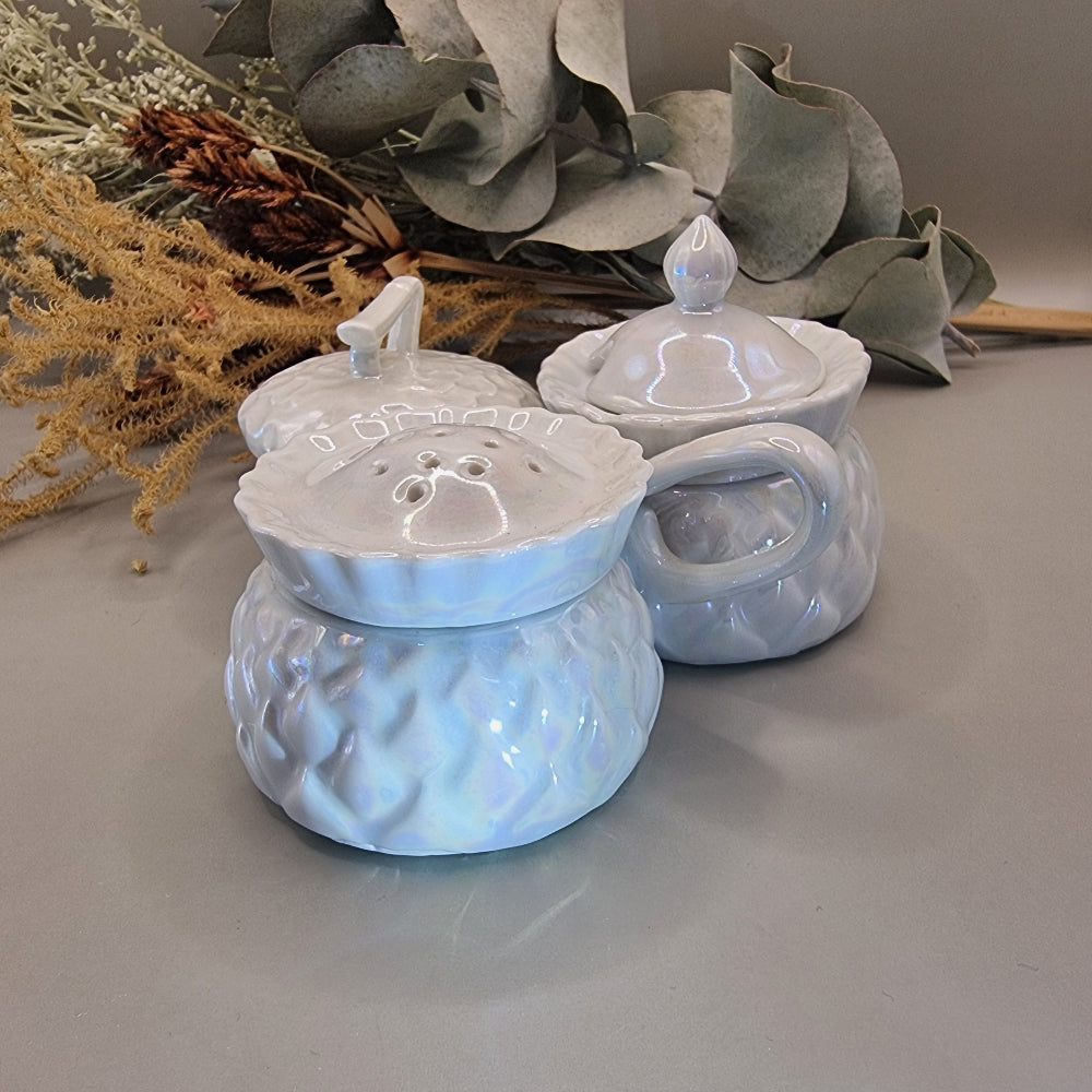 Sparkling vintage ceramic condiment set with pearly glaze. Lidded pots and shaker with central handle.