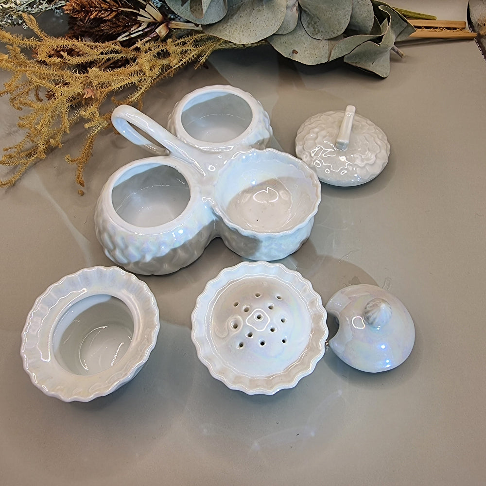 Sparkling vintage ceramic condiment set with pearly glaze. Lidded pots and shaker with central handle.