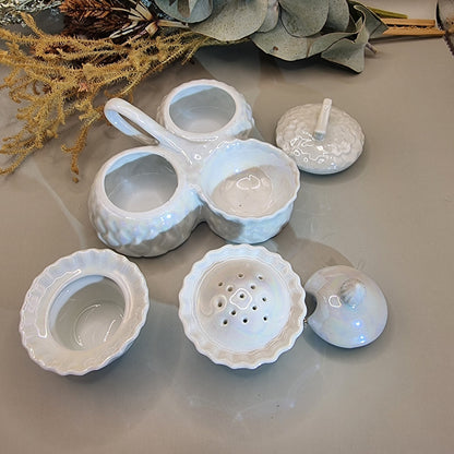 Sparkling vintage ceramic condiment set with pearly glaze. Lidded pots and shaker with central handle.