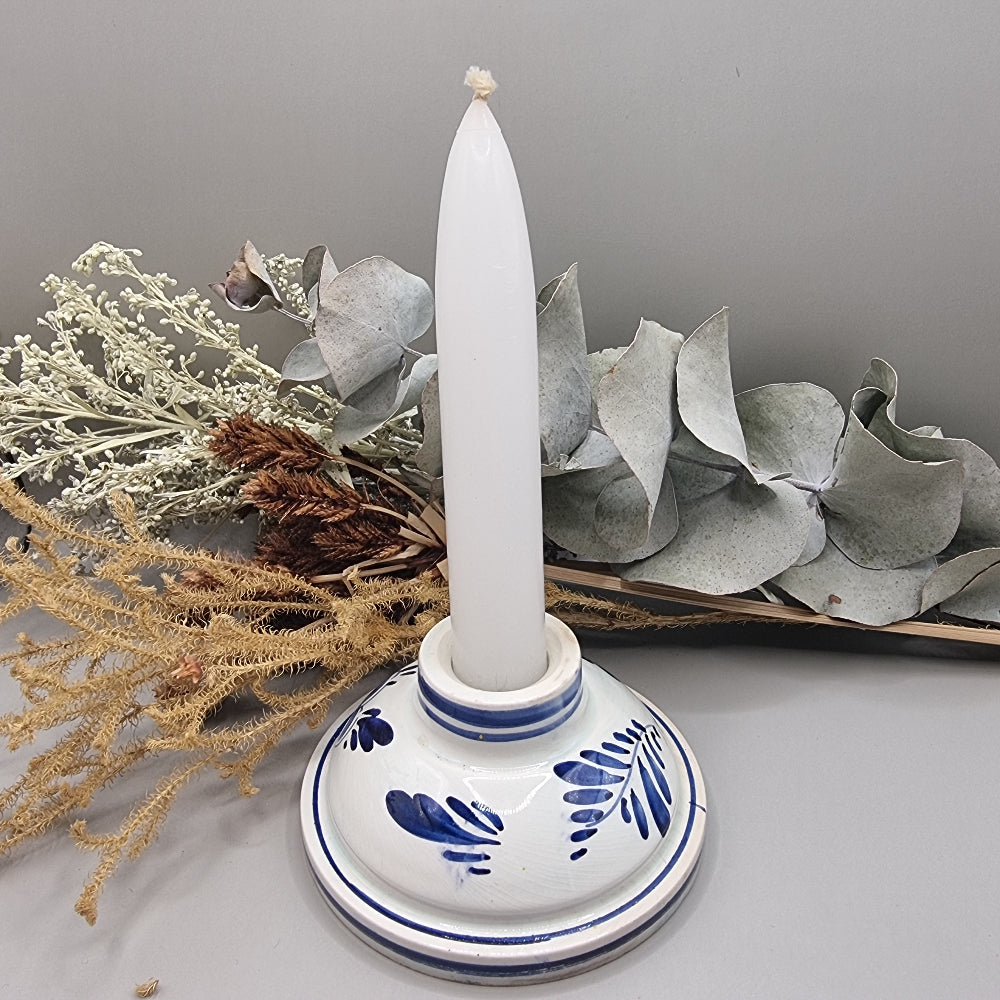 Dutch Delft inspired blue and white ceramic candle holder with cobalt floral design.