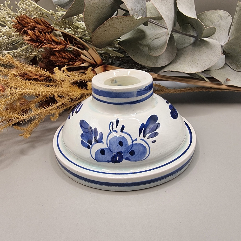 Dutch Delft inspired blue and white ceramic candle holder with cobalt floral design.