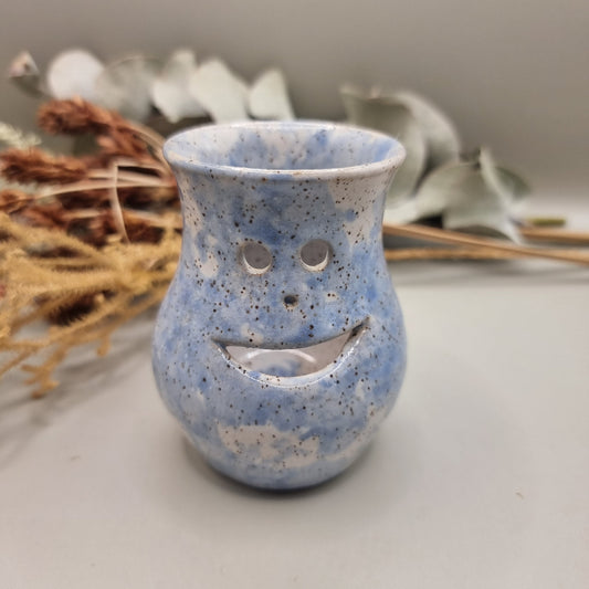 Vintage pottery face jug with blue speckle glaze and smiling face