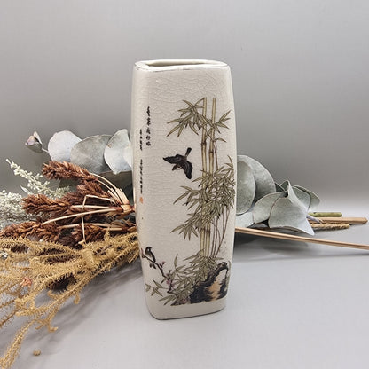 Vintage oriental-style ceramic vase with bamboo and bird design on crackle glaze.