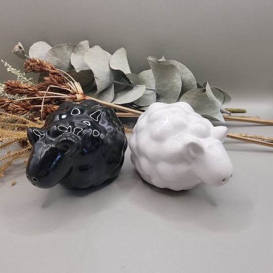 Black and white ceramic sheep salt and pepper shakers in glossy finish.